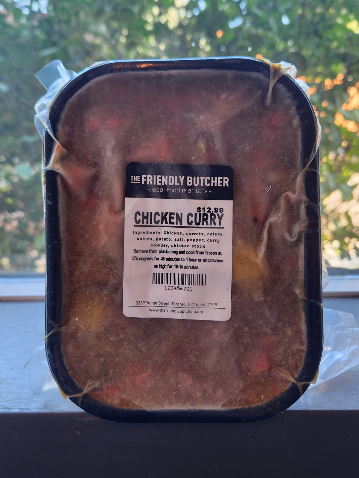 Sealed tray of Chicken Curry with a Friendly Butcher label