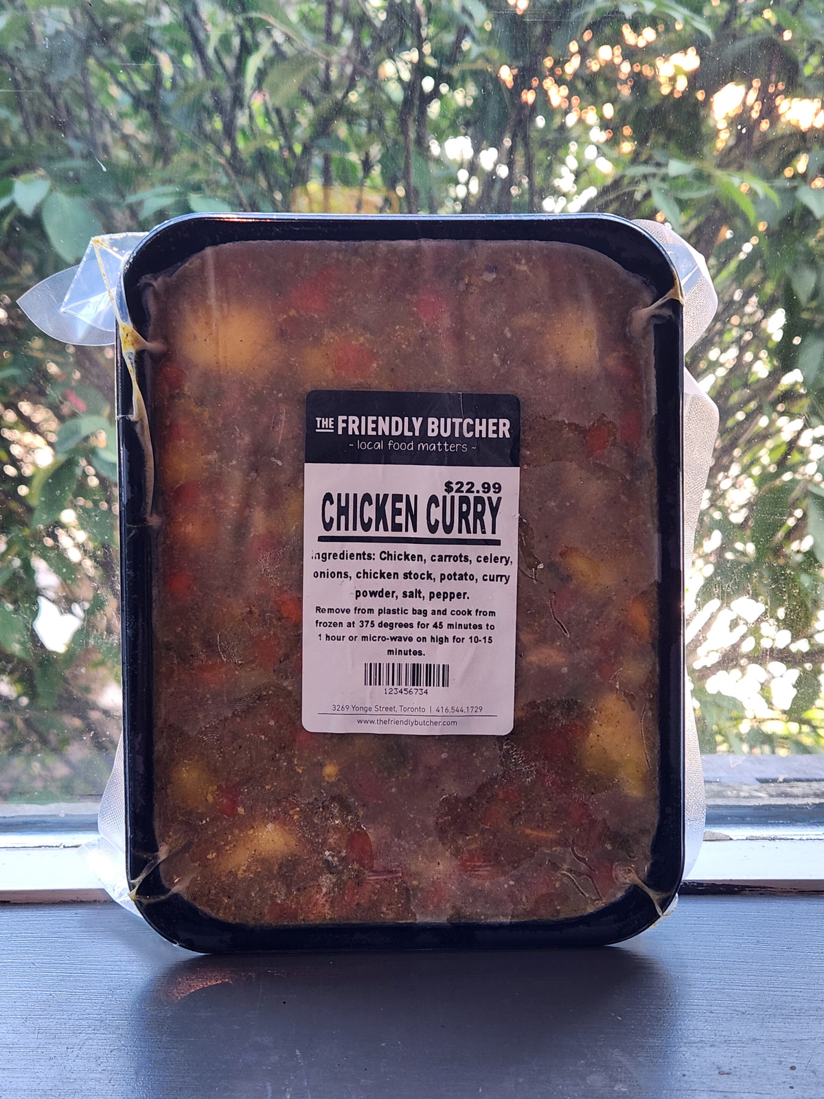 Sealed tray of Chicken Curry with a Friendly Butcher label